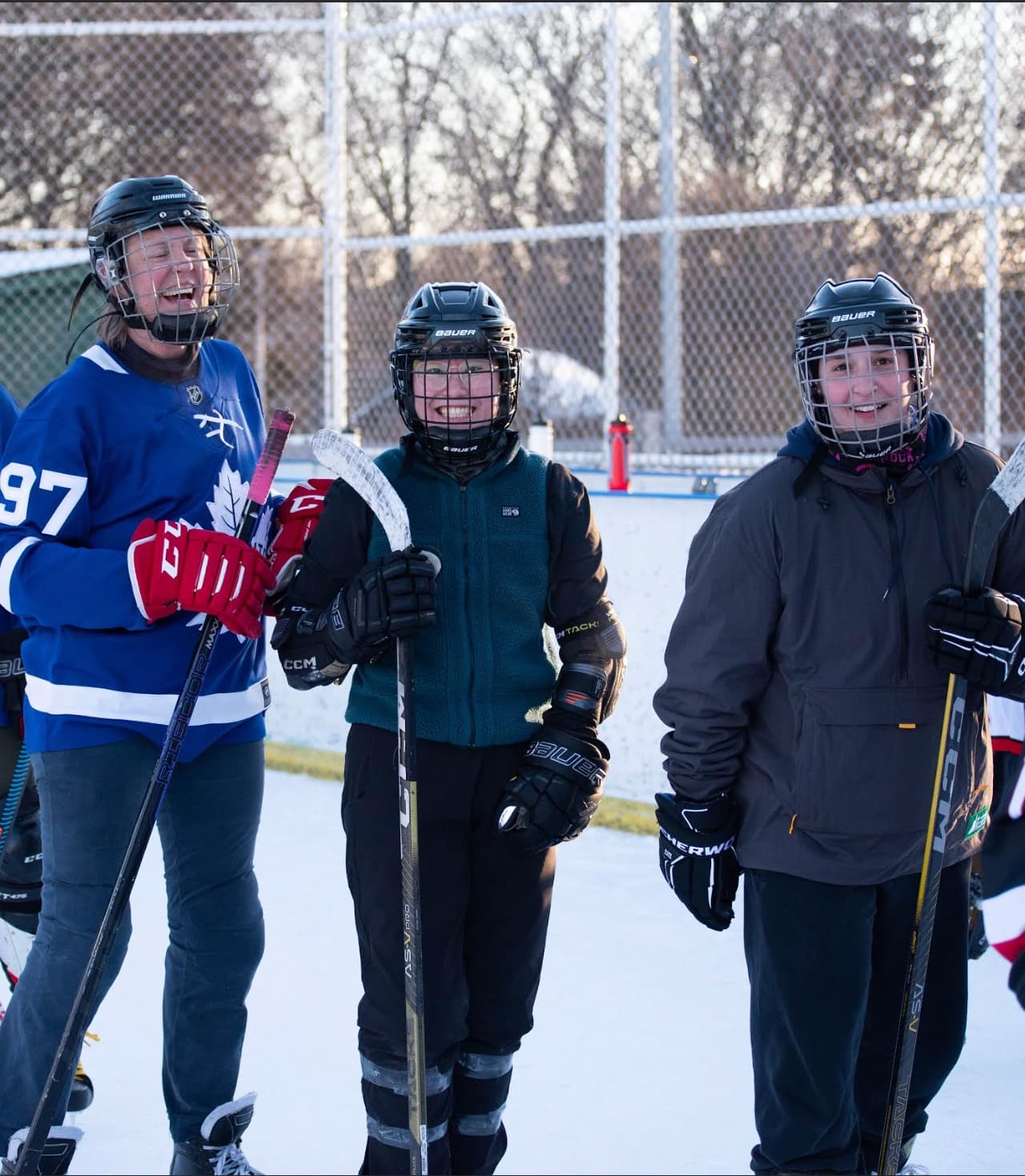 Women playing hockey